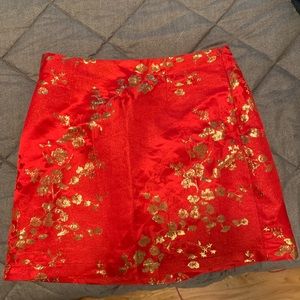 Never worn forever 21 red skirt with gold flowers